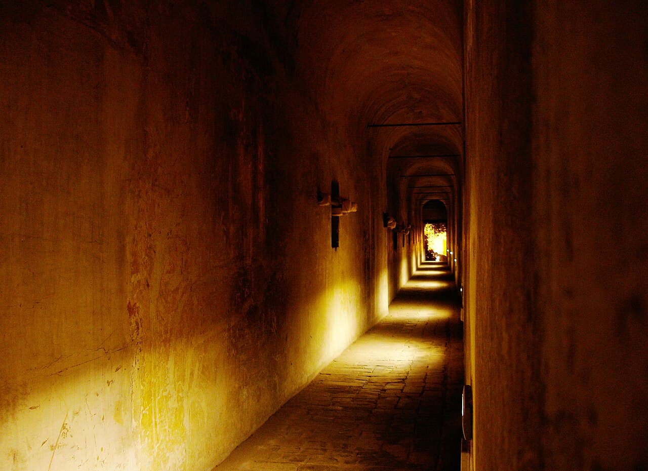 Interior view of the Passetto di Borgo, the fortified corridor connecting the Vatican to Castel Sant'Angelo, showing the brick and stone construction of the medieval walkway