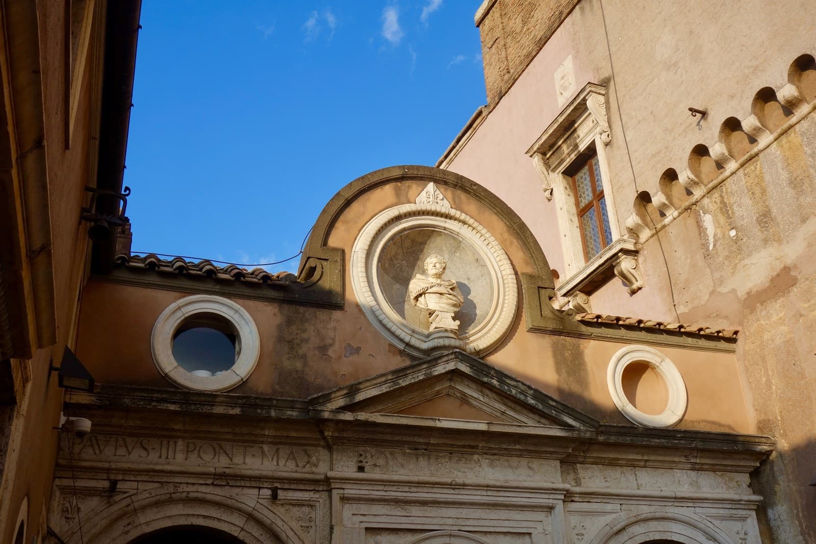 The Cortile dell'Angelo at Castel Sant'Angelo, the rectangular open courtyard at the heart of the upper levels, with the 1544 marble statue of Saint Michael by Raffaello da Montelupo standing at its centre