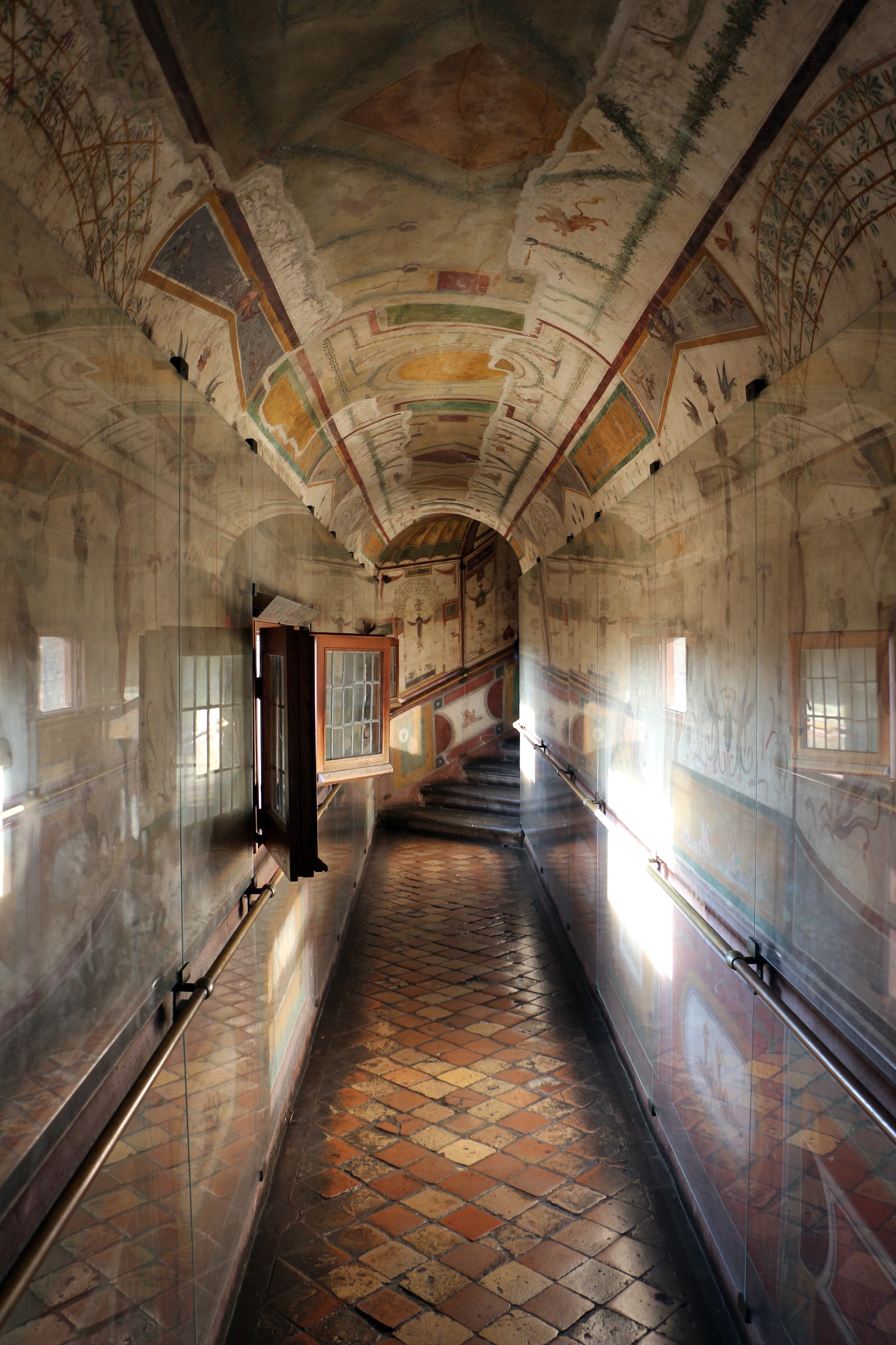 The Pompeian Corridor at Castel Sant'Angelo, the narrow frescoed passage that leads from the Sala Paolina into the Sala della Biblioteca. Walls and barrel vault are covered with grotesque decoration painted by Luzio Luzi, Perin del Vaga and their workshop in 1545-1546.