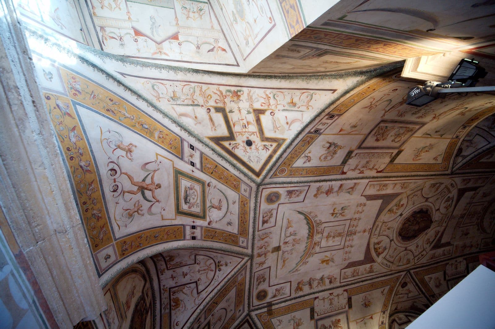 The Sala di Apollo at Castel Sant'Angelo, the oldest hall of the papal apartments, with its long barrel vault decorated with grotesques on a white ground and ten scenes from the myth of Apollo