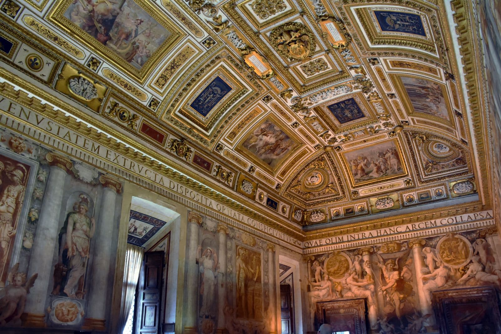 The Sala Paolina at Castel Sant'Angelo, an opulent Renaissance hall with gilded coffered ceiling and walls covered in frescoes by Perin del Vaga and his collaborators (1545-1547)
