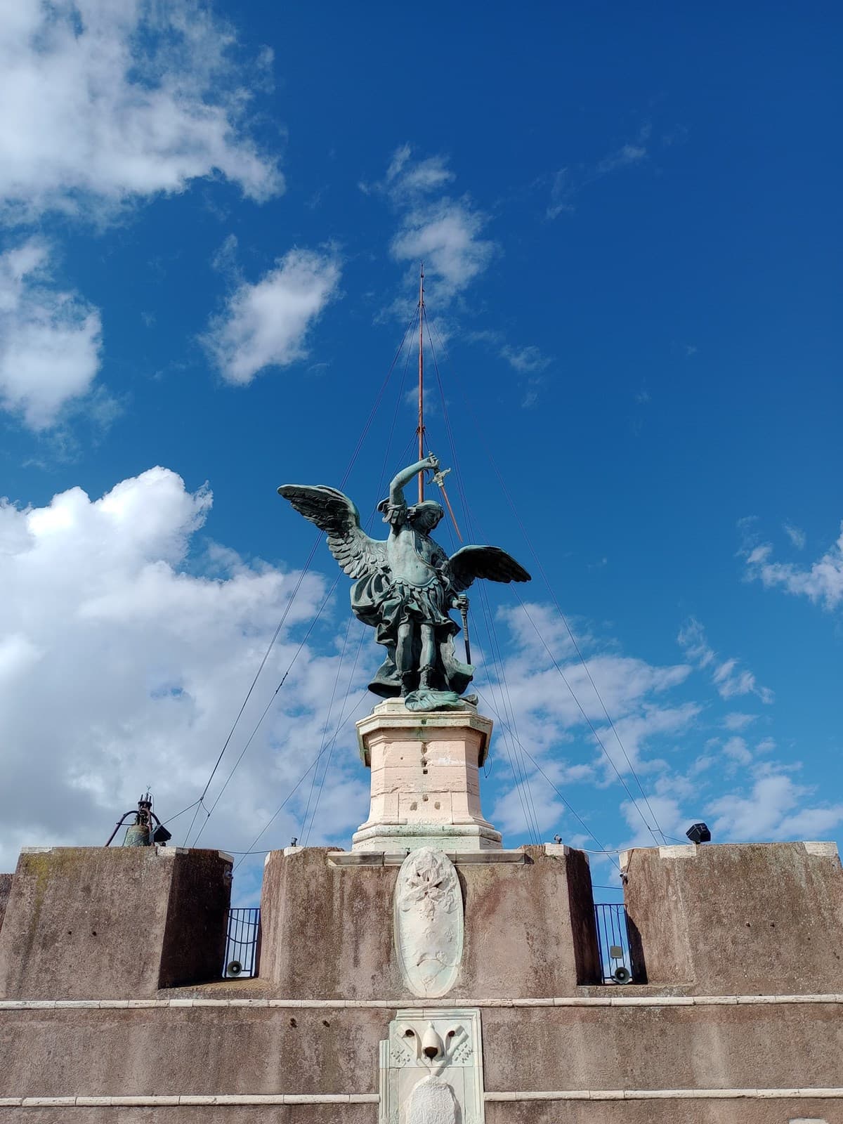 The bronze statue of the Archangel Michael by Peter Anton von Verschaffelt (1752) sheathing his sword, photographed from below on the Terrazza dell'Angelo
