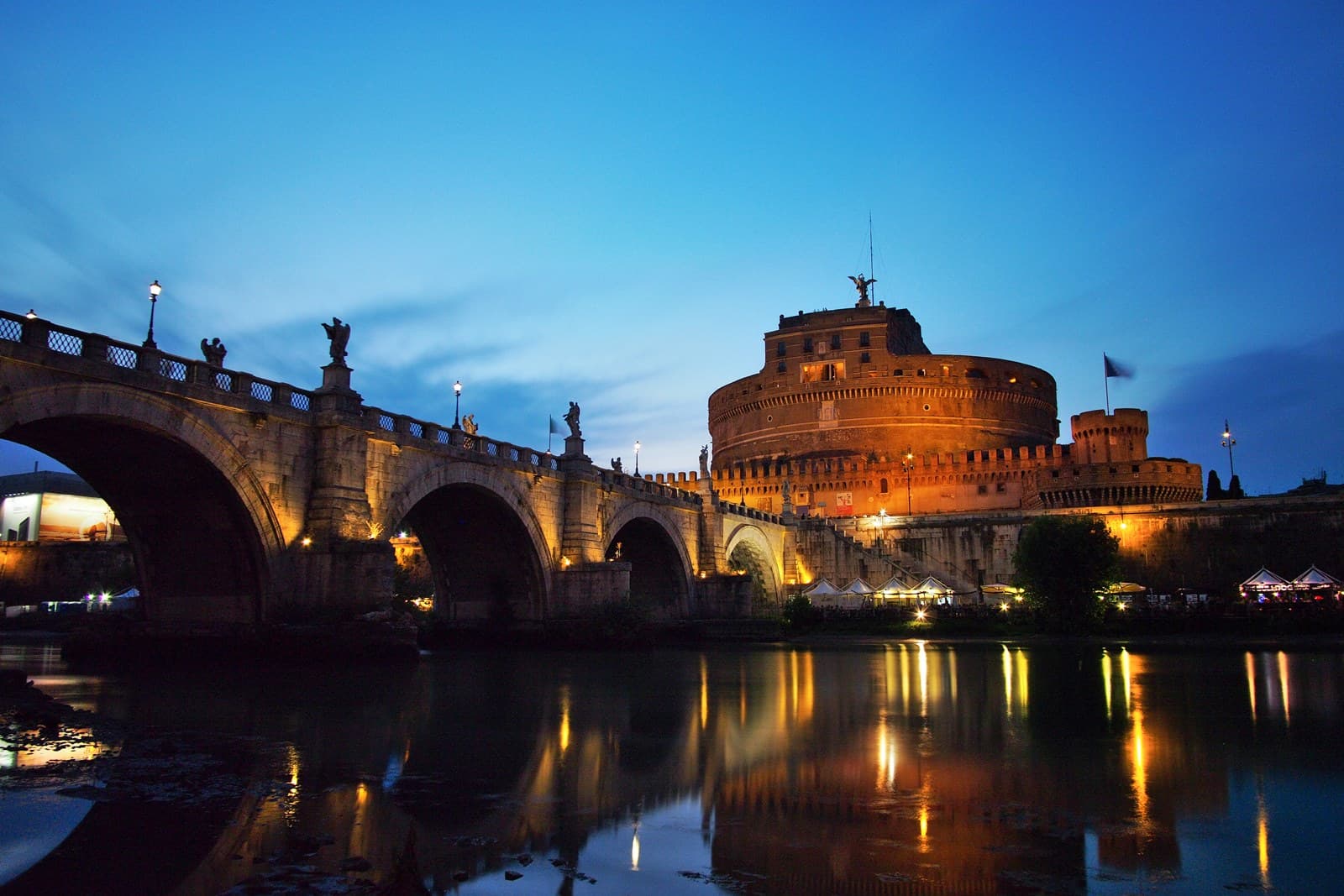 Castel Sant'Angelo at sunset photographed from the Tiber, the setting of the third act of Puccini's Tosca where Floria Tosca jumps from the battlements at dawn
